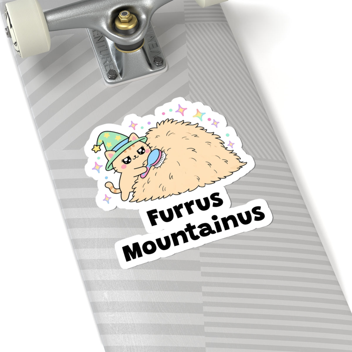 Furrus Mountainus wizard cat sticker on a grey skateboard deck near the truck
