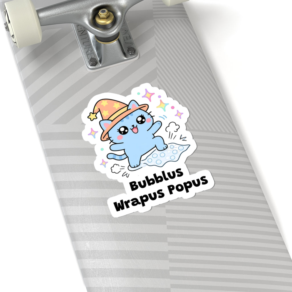 Bubblus Wrapus Popus wizard cat sticker on a grey skateboard deck near the truck