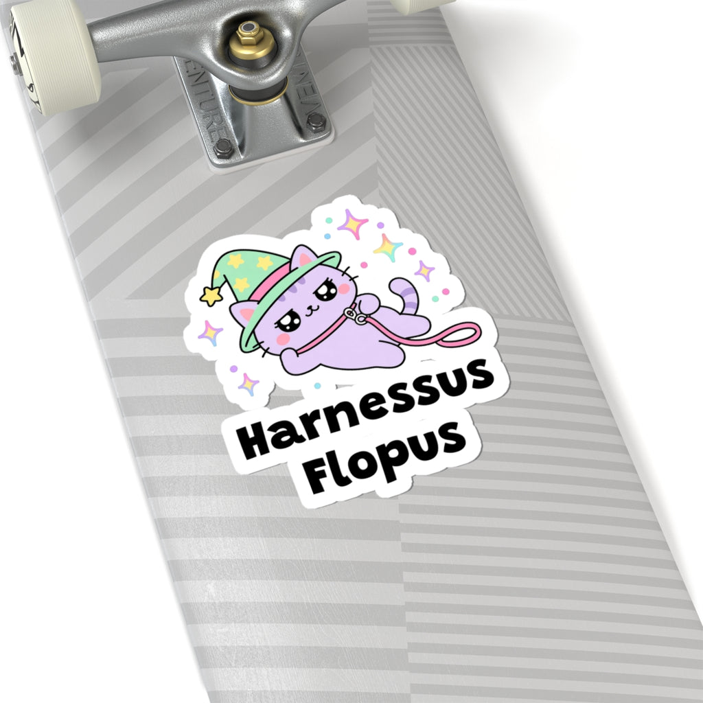 Harnessus Flopus wizard cat sticker on a grey skateboard deck near the truck