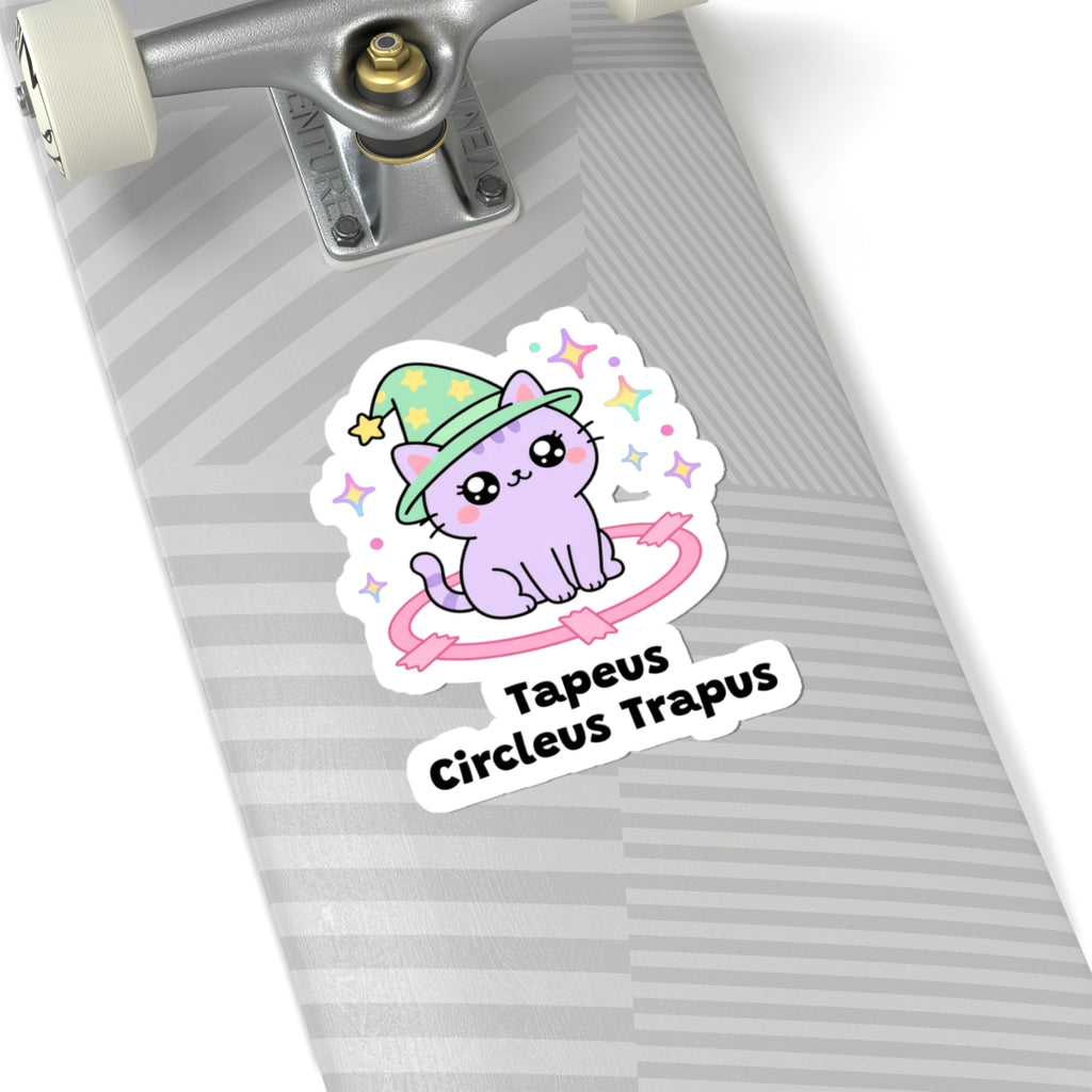 Tapeus Circleus Trapus wizard cat sticker on a grey skateboard deck near the truck