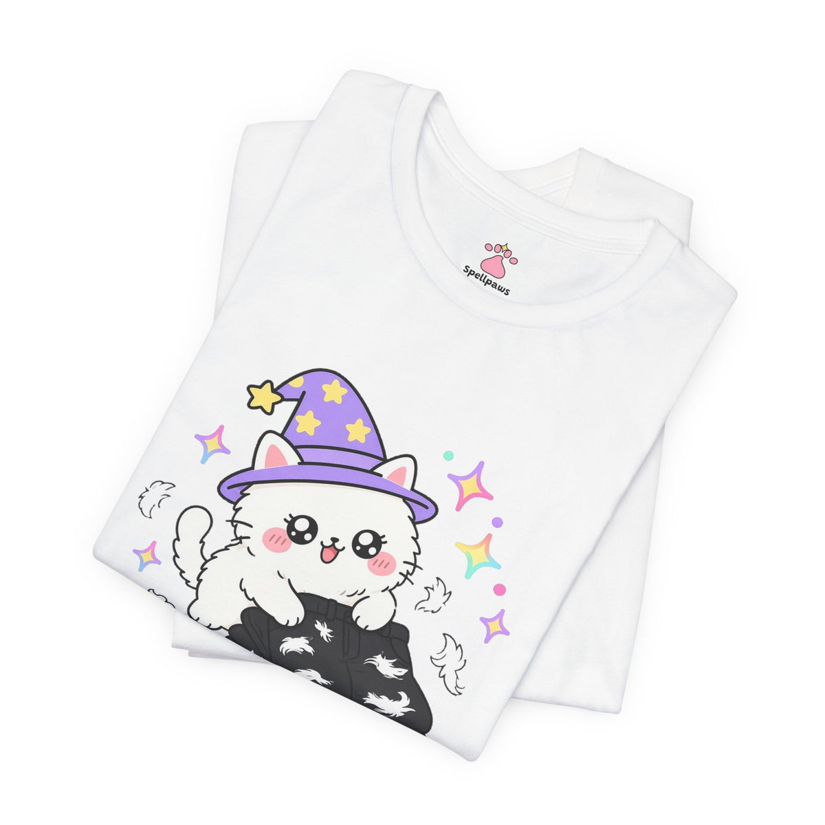 Folded white Furrus Pantsus Blackus T-shirt showing a close-up of the fluffy white wizard cat in a purple hat lying on a pair of black pants covered in fur