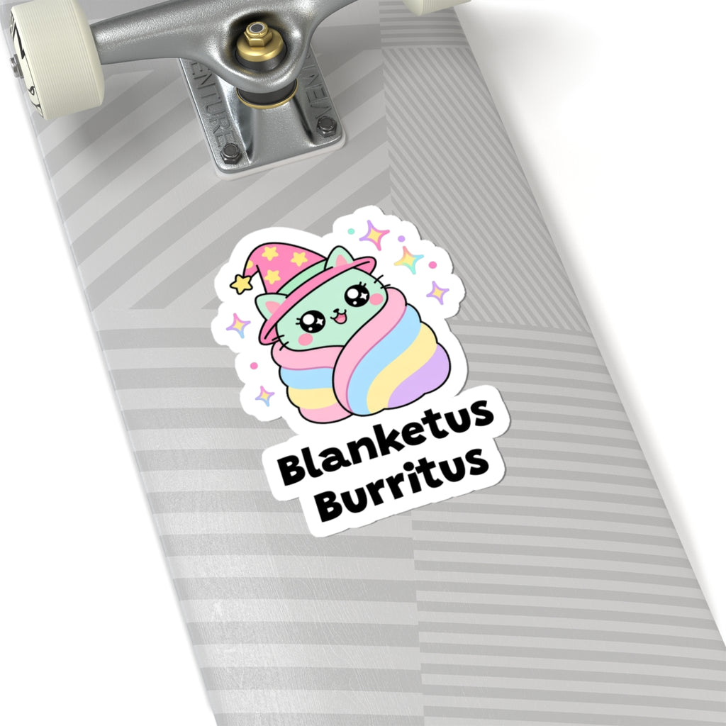 Blanketus Burritus wizard cat sticker on a grey skateboard deck near the truck