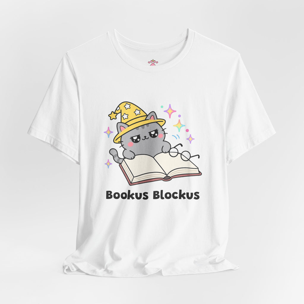 Gray wizard cat in a yellow hat lying across the pages of an open book, Bookus Blockus tee