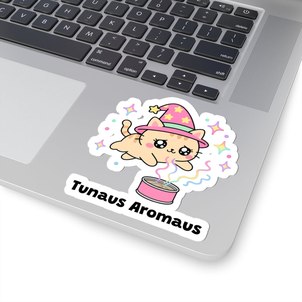 Tunaus Aromaus wizard cat sticker stuck on a silver laptop next to the keyboard