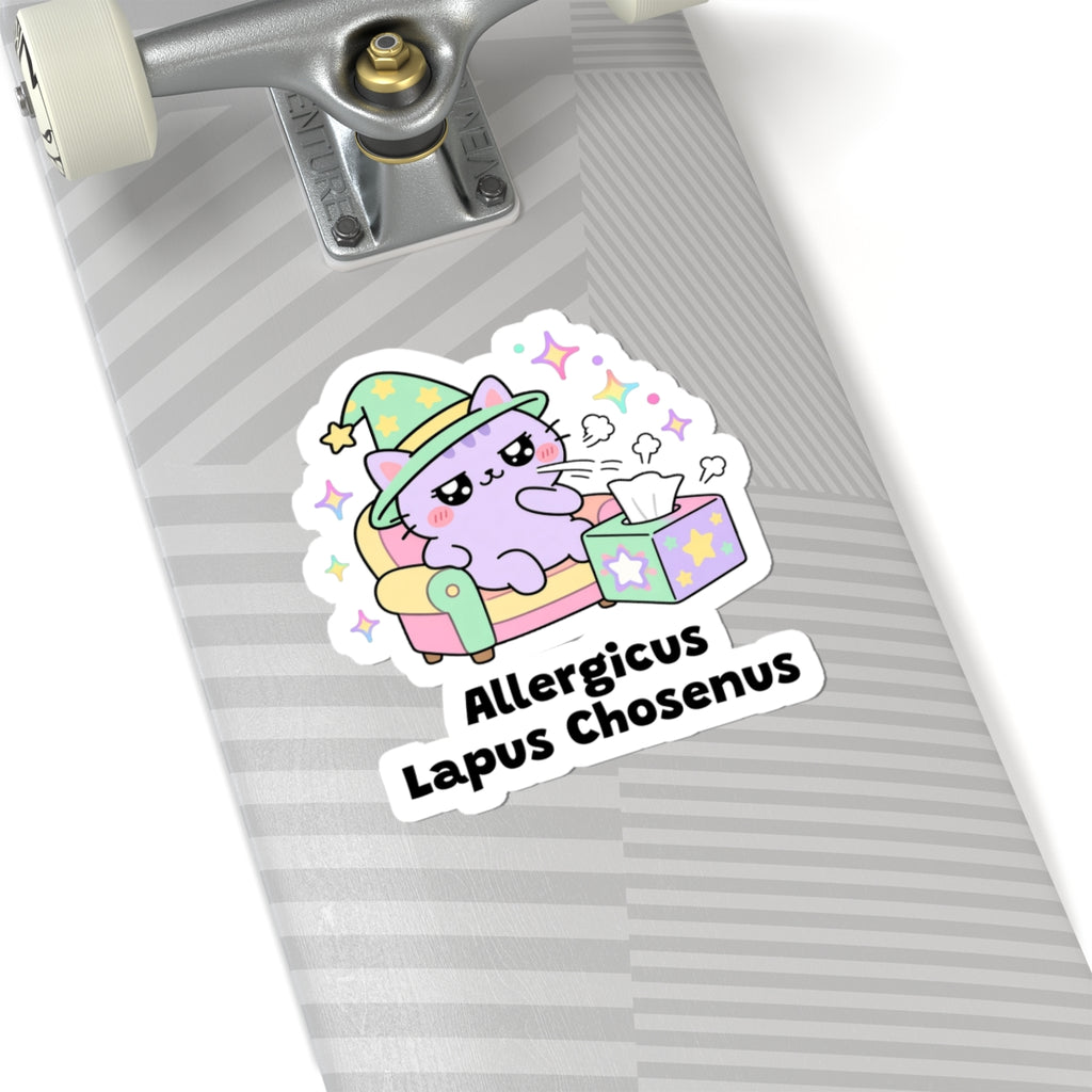 Allergicus Lapus Chosenus wizard cat sticker on a grey skateboard deck near the truck