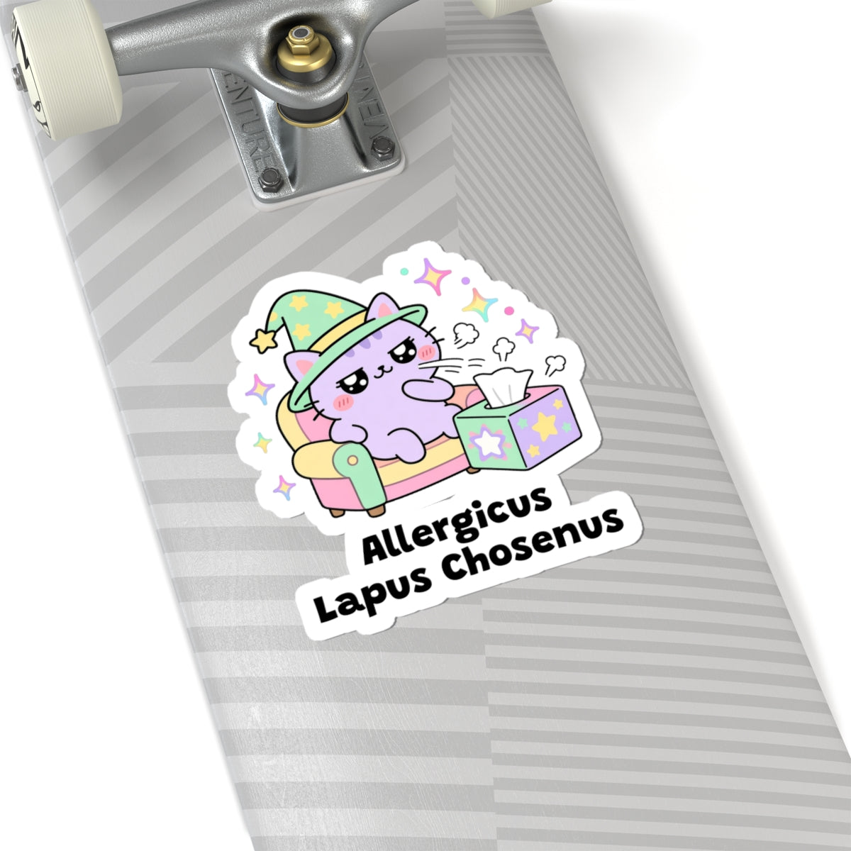 Allergicus Lapus Chosenus wizard cat sticker on a grey skateboard deck near the truck