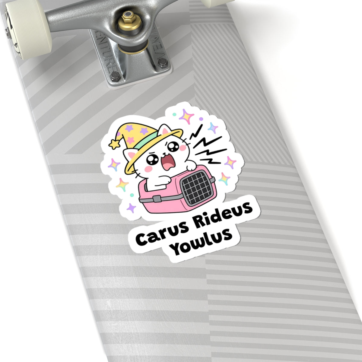 Carus Rideus Yowlus wizard cat sticker on a grey skateboard deck near the truck