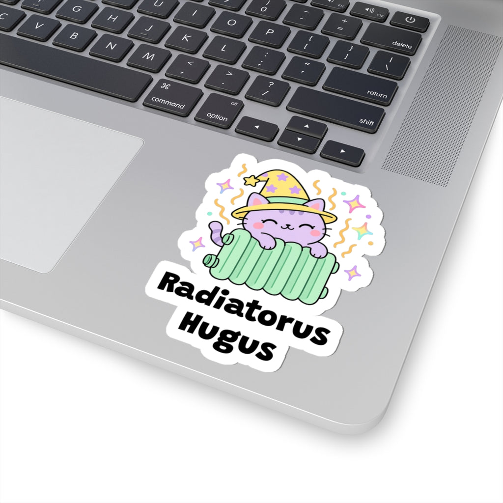 Radiatorus Hugus wizard cat sticker stuck on a silver laptop next to the keyboard