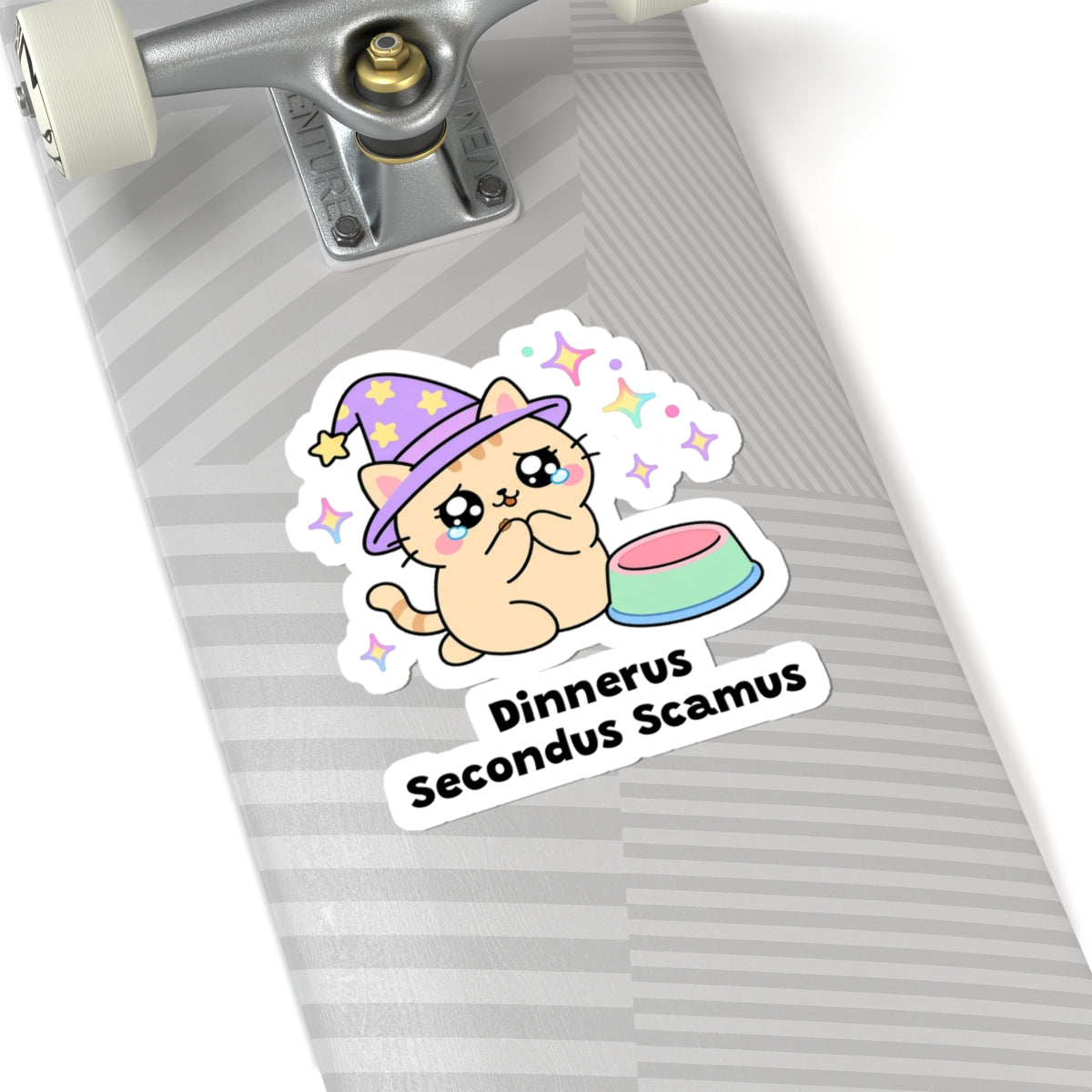 Dinnerus Secondus Scamus wizard cat sticker on a grey skateboard deck near the truck