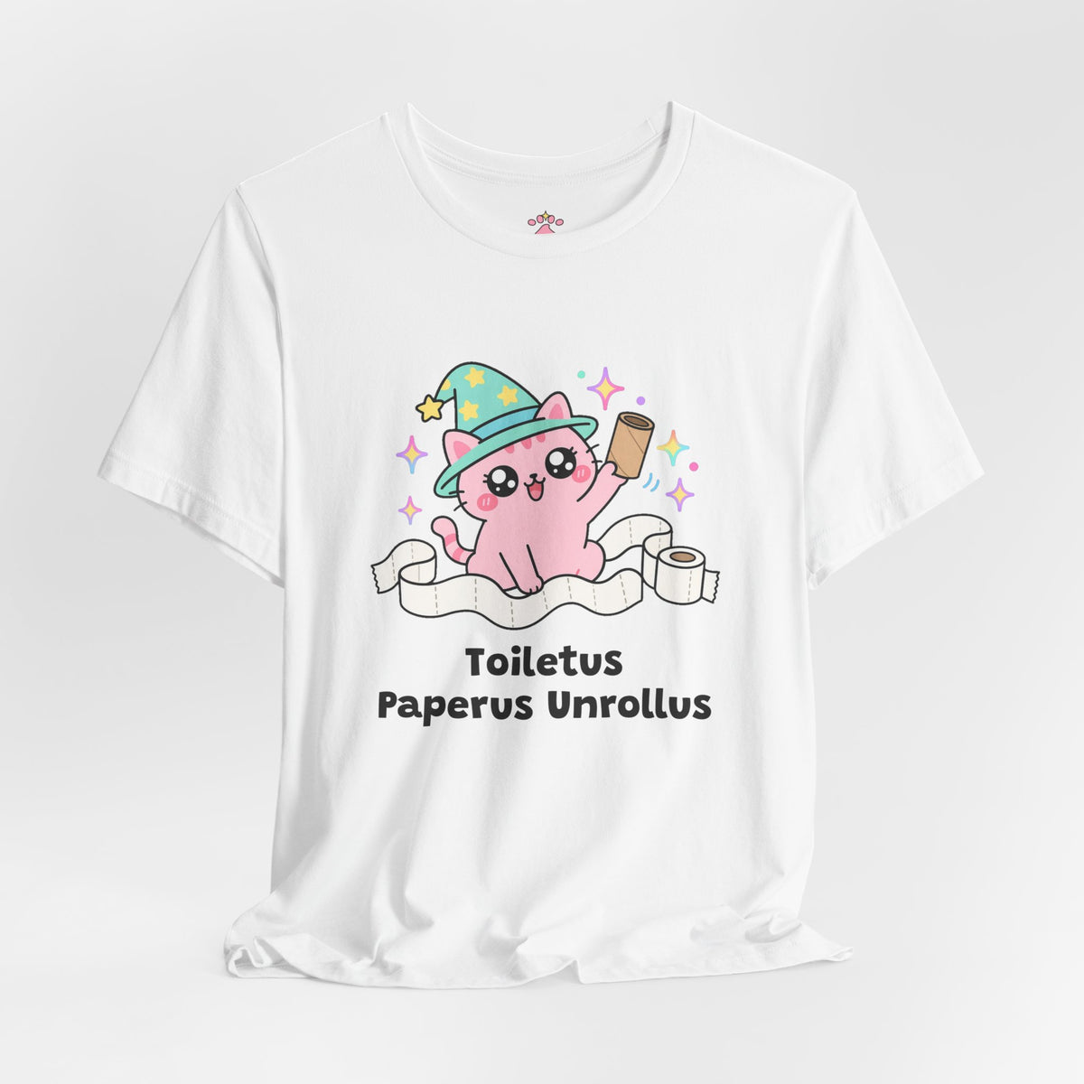 White Toiletus Paperus Unrollus wizard cat T-shirt shown in a soft studio setting: pink wizard cat in a mint star hat holding an empty cardboard roll, surrounded by unrolled toilet paper