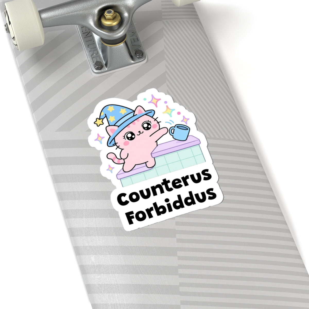Counterus Forbiddus wizard cat sticker on a grey skateboard deck near the truck
