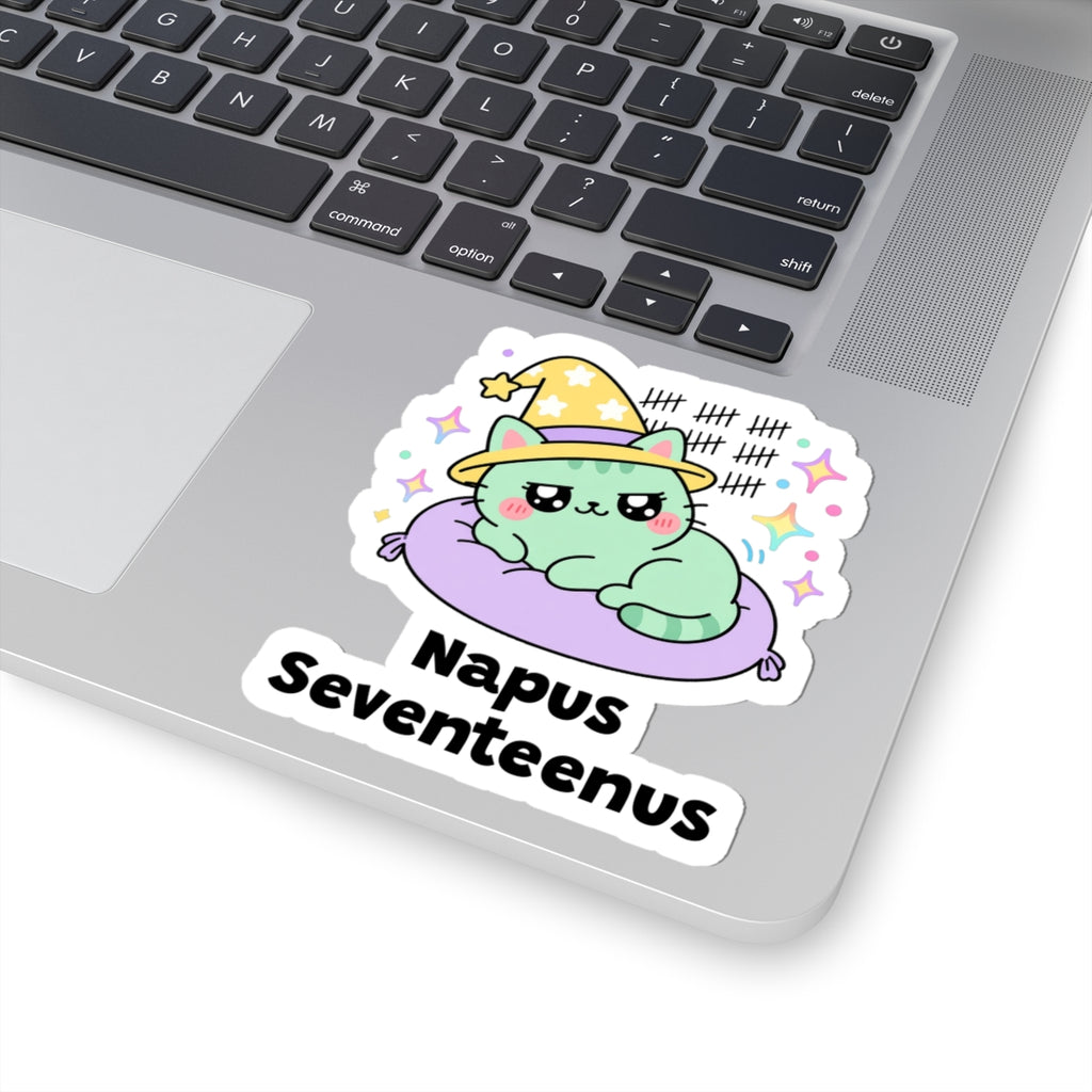 Napus Seventeenus wizard cat sticker stuck on a silver laptop next to the keyboard