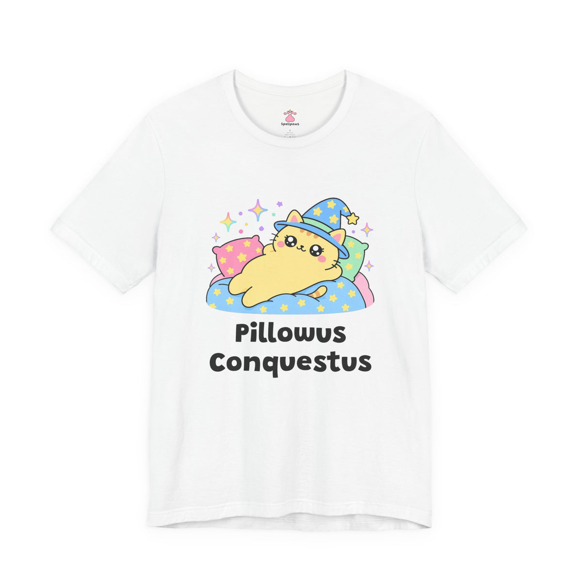 White Pillowus Conquestus wizard cat T-shirt, front view: yellow wizard cat in a blue hat sprawled across a pile of pillows on a starry blanket, with "Pillowus Conquestus" printed below