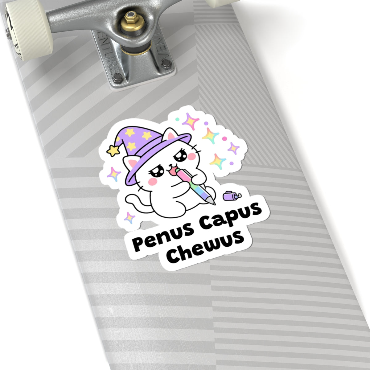 Penus Capus Chewus wizard cat sticker on a grey skateboard deck near the truck