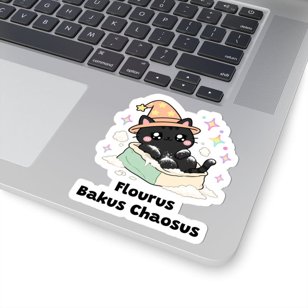 Flourus Bakus Chaosus wizard cat sticker stuck on a silver laptop next to the keyboard