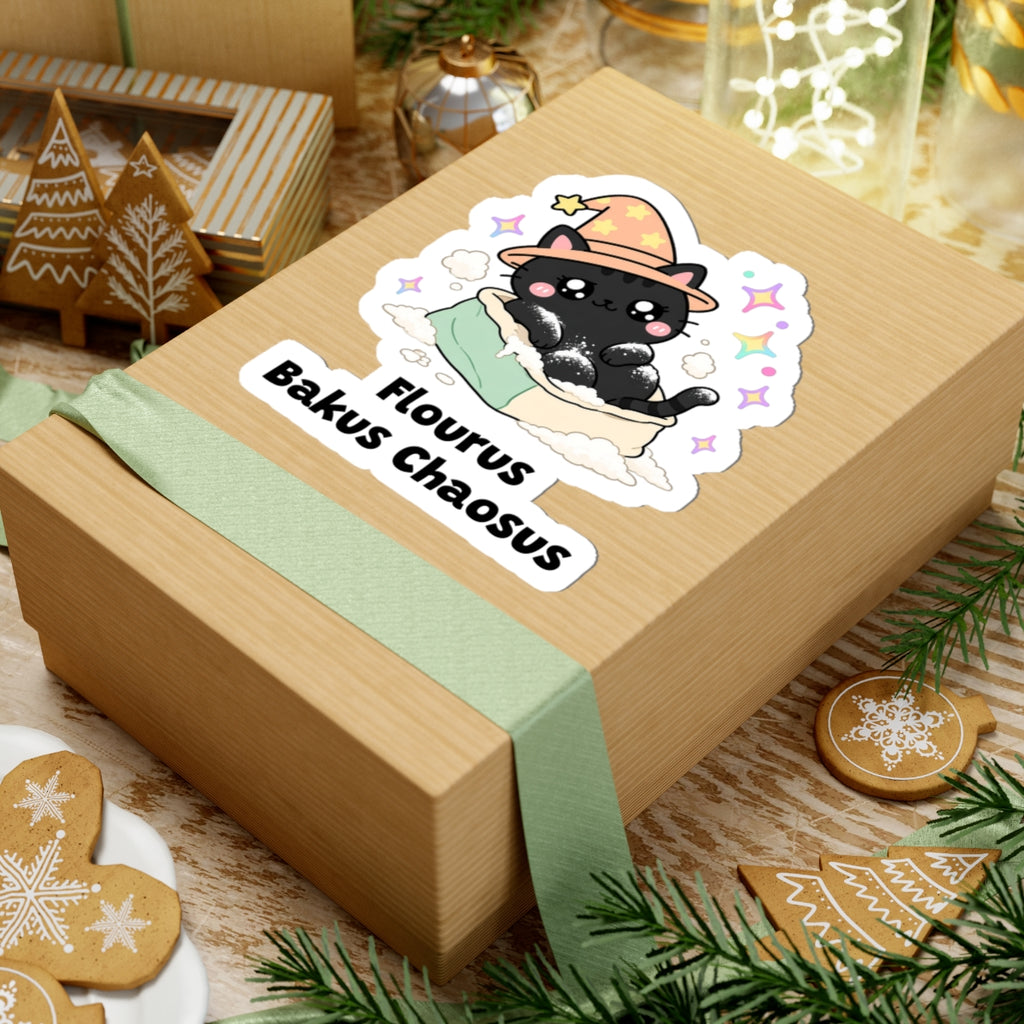 Flourus Bakus Chaosus wizard cat sticker on a kraft gift box with a green ribbon and holiday cookies