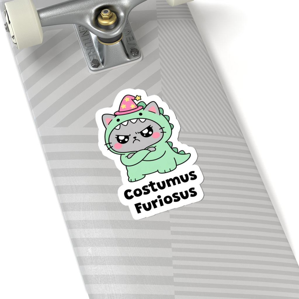 Costumus Furiosus wizard cat sticker on a grey skateboard deck near the truck