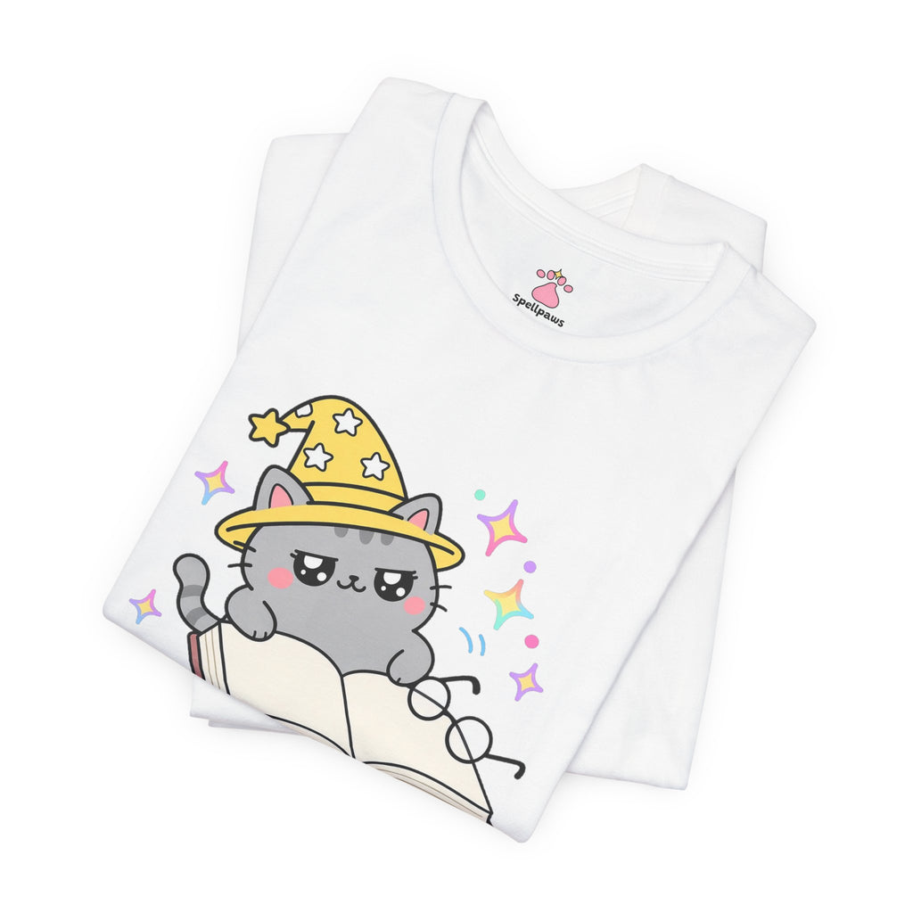Gray wizard cat in a yellow hat lying across the pages of an open book, Bookus Blockus tee