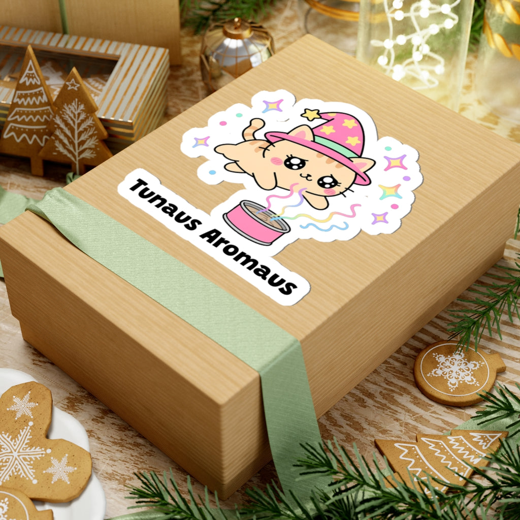 Tunaus Aromaus wizard cat sticker on a kraft gift box with a green ribbon and holiday cookies