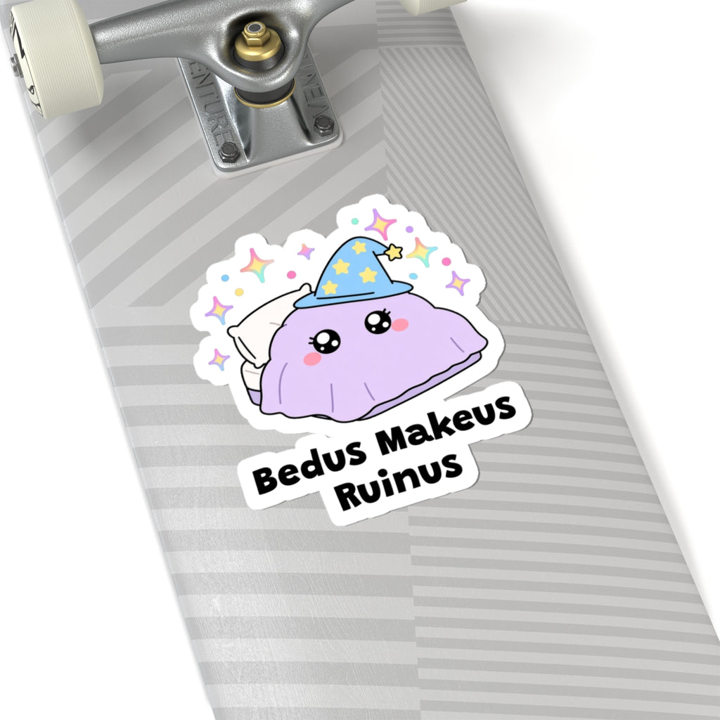 Bedus Makeus Ruinus wizard cat sticker on a grey skateboard deck near the truck
