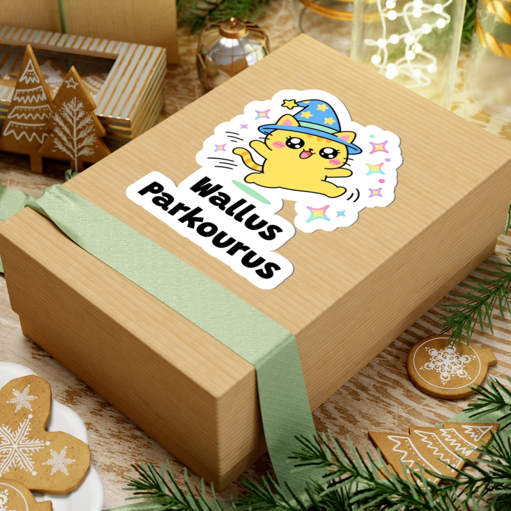 Wallus Parkourus wizard cat sticker on a kraft gift box with a green ribbon and holiday cookies