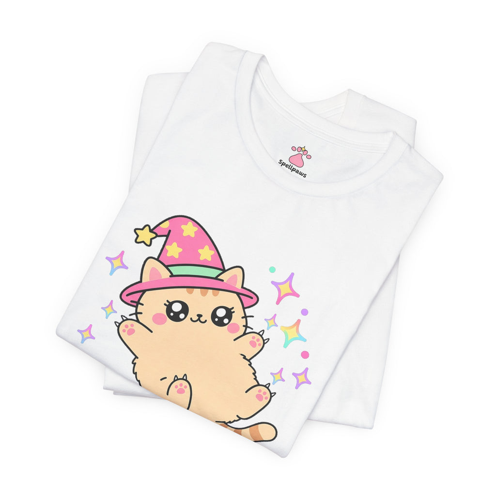 Folded white Bellyus Trapus T-shirt showing a close-up of the peach wizard cat in a pink star hat lying on its back showing its fluffy belly