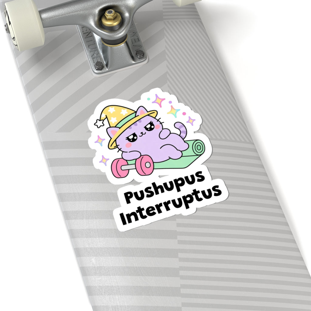 Pushupus Interruptus wizard cat sticker on a grey skateboard deck near the truck