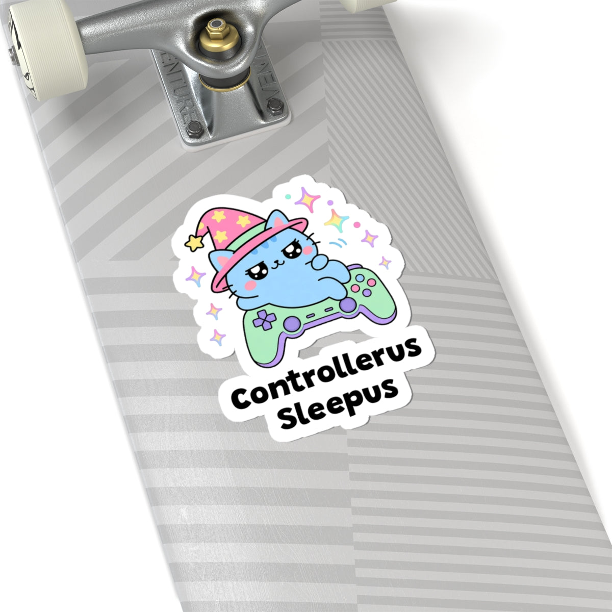 Controllerus Sleepus wizard cat sticker on a grey skateboard deck near the truck