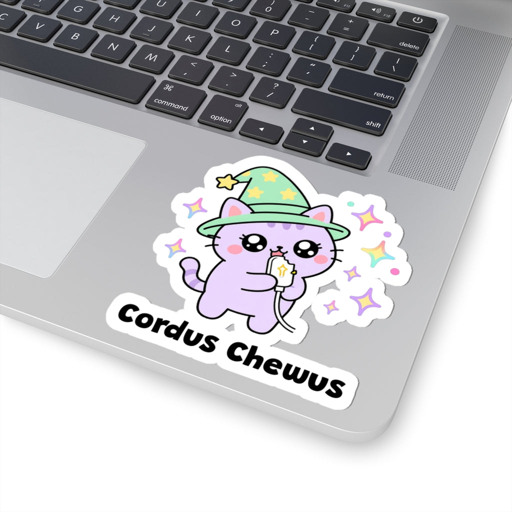 Cordus Chewus wizard cat sticker stuck on a silver laptop next to the keyboard