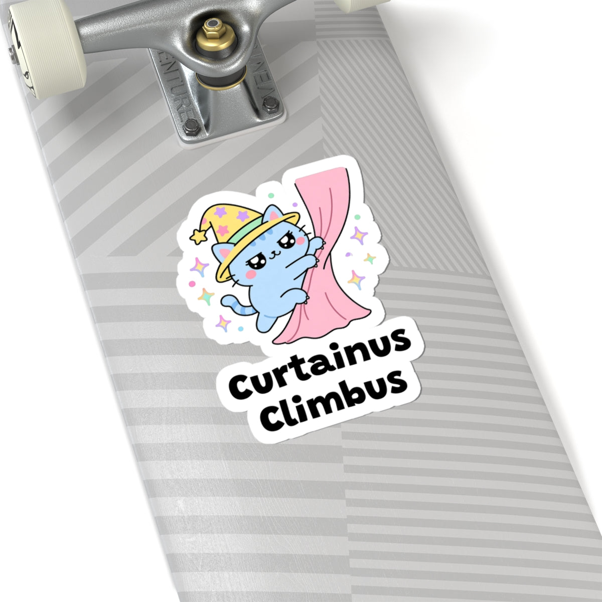 Curtainus Climbus wizard cat sticker on a grey skateboard deck near the truck