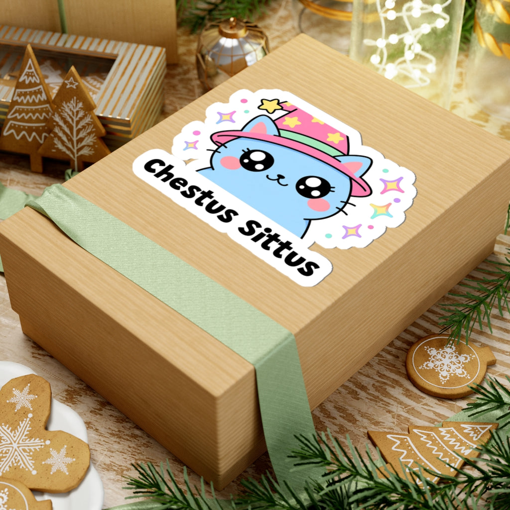 Chestus Sittus wizard cat sticker on a kraft gift box with a green ribbon and holiday cookies